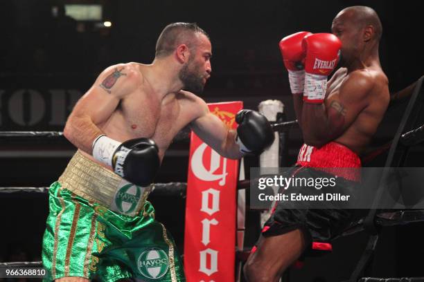 Stephen Ormond lands a left hand against Michael Clark at the Lowell Memorial Auditorium in Lowell, MA on October 10, 2015. Ormond would win by...