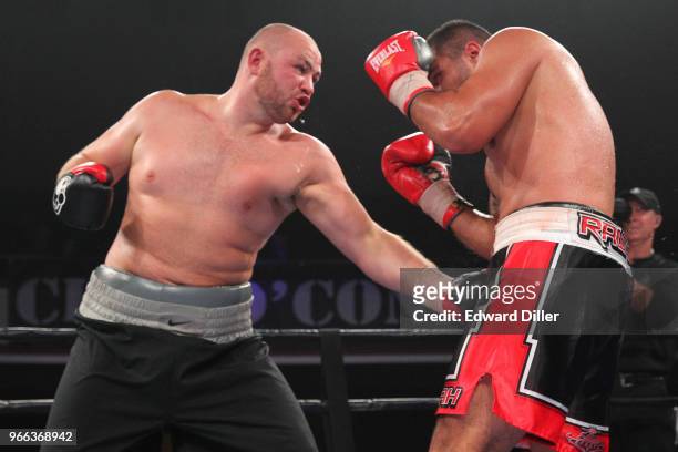 Adam Kownacki lands a left hand against Rodney Hernandez at the Lowell Memorial Auditorium in Lowell, MA on October 10, 2015. Kownacki would win by...