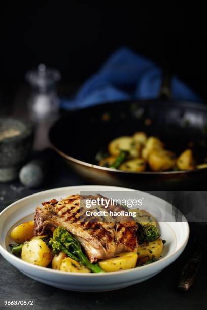 grilled pork chop with garlic sauté  potatoes - haoliang stock pictures, royalty-free photos & images