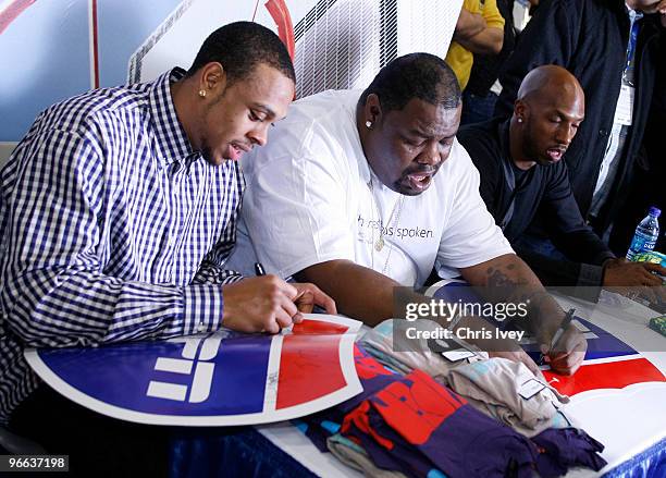 Shannon Brown of the Los Angeles Lakers; DJ Biz Markie; Chauncey Billups of the Denver Nuggets sign autographs for fans during a appearance in the...