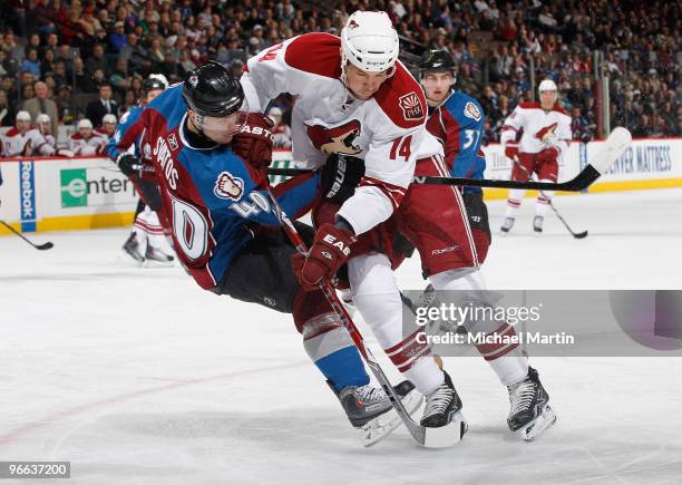 Marek Svatos of the Colorado Avalanche collides against Taylor Pyatt of the Phoenix Coyotes at the Pepsi Center on February 12, 2010 in Denver,...
