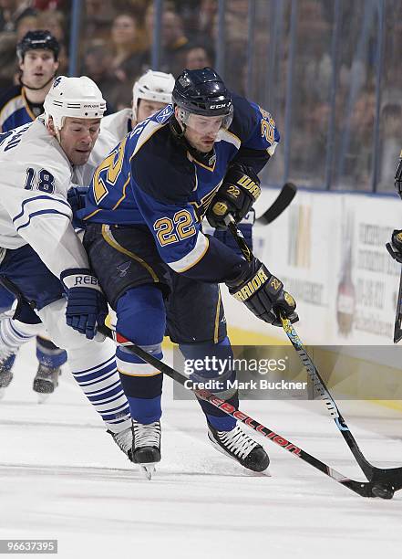 Brad Boyes of the St. Louis Blues battles for the puck with Wayne Primeau of the Toronto Maple Leafs on February 12, 2010 at Scottrade Center in St....