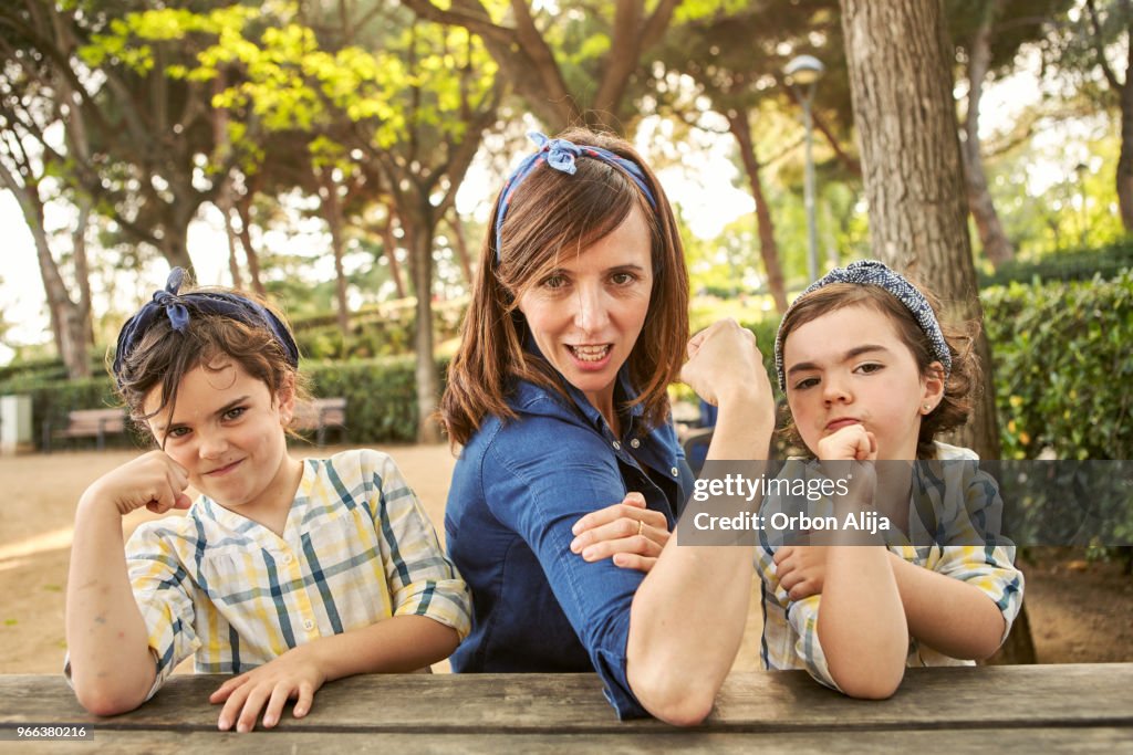 Strong mom flexing her arms - Girl power