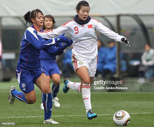 Duan Han of Chinese Taipei competes for the ball during the East Asian Football Federation Women's Championship 2010 match between Chinese Taipei and...