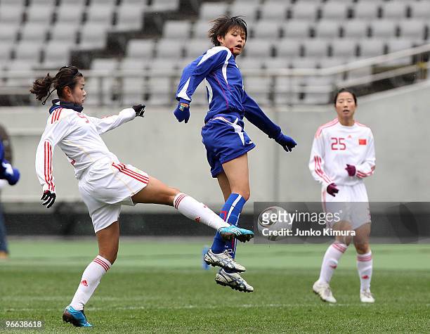 Ya Han Lin of Chinese Taipei and Duan Han of China compete for the ball during the East Asian Football Federation Women's Championship 2010 match...