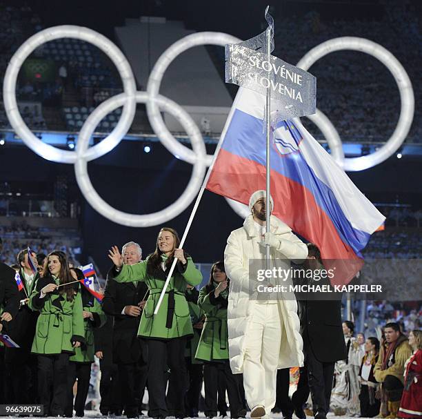 The Slovenian delegation tours the stadium, with Slovenia's alpine skier Tina Maze as the flag bearer, at BC Place during the opening ceremony of the...