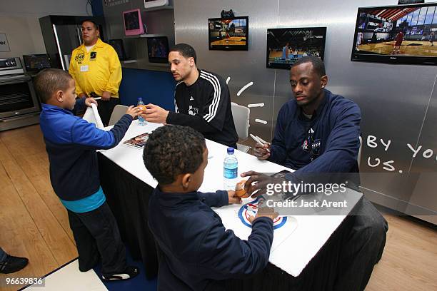 Dwayne Jones of the Austin Toros and Earl Barron of the Iowa Energy sign autographs at the Haier venue during All Star Weekend on February 12, 2010...