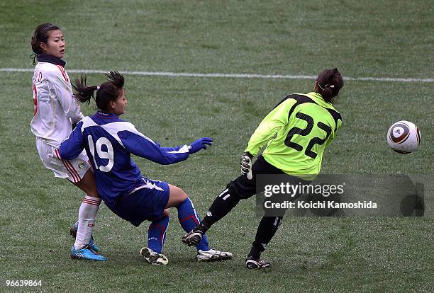 Duan Han of Chinese Taipei kicks the ball to score a goal during the East Asian Football Federation Women's Championship 2010 match between Chinese...