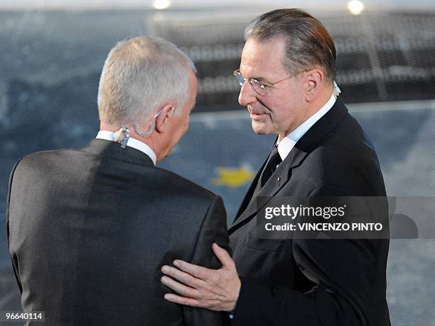 President Belgian doctor Jacques Rogge salutes Canadian VANOC President John Furlong during the opening ceremony of the Vancouver 2010 Winter...