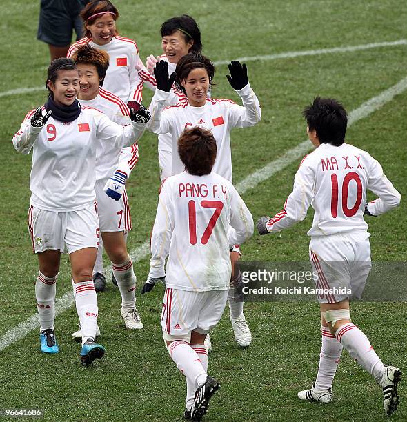 Duan Han of China celebrates with her teammates after scoring a goal during the East Asian Football Federation Women's Championship 2010 match...
