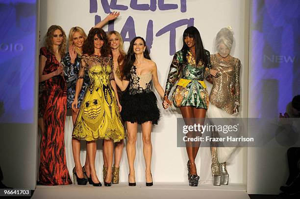 Helena Christensen , Georgina Chapman , Naomi Campbell and Daphne Guinness pose with models wearing Alexander McQueen designs on the runway at Naomi...