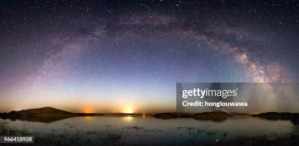 milky way arch bridge - planetary science stock pictures, royalty-free photos & images