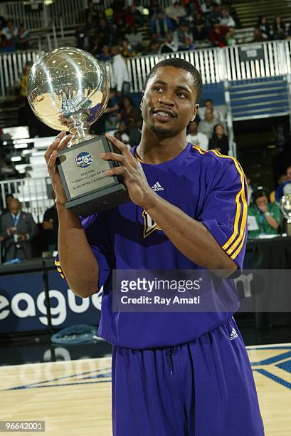 Dar Tucker of the Los Angeles D-Fenders holds the trophy after winning the Slam Dunk Contest as part of the NBA D-League Dream Factory Friday Night...