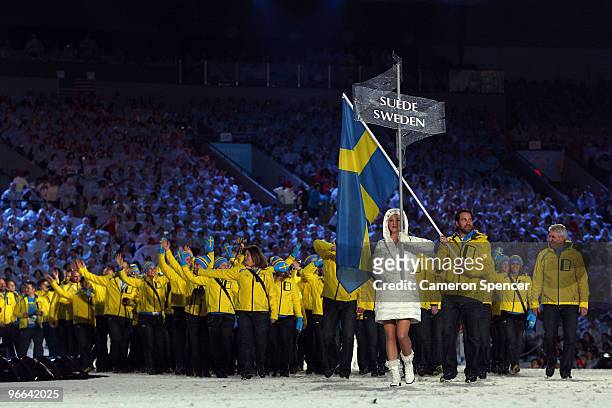 Peter Forsberg of Sweden carries his national flag into the stadium during the Opening Ceremony of the 2010 Vancouver Winter Olympics at BC Place on...