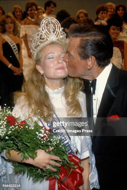 Bob Barker kisses a contestant during Miss Universe on July 9,1984 in Miami.