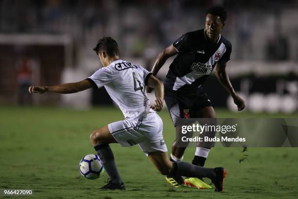Fabricio of Vasco da Gama struggles for the ball with Marcinho of Botafogo during a match between Vasco da Gama and Botafogo as part of Brasileirao...
