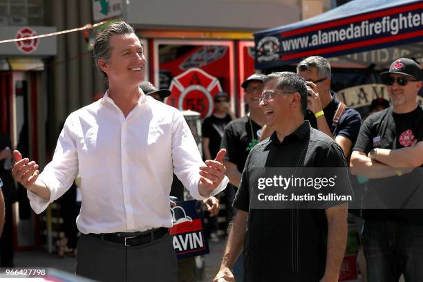 California Lt. Gov. And democratic candidate for California governor Gavin Newsom jokes with California attorney general Xavier Becerra during a...