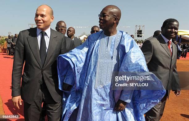 Senegalese Prime Minister Ndene Mbaye speaks with Minister of State of Senegal, Karim Wade and Senegal's Minister of Economy and Finance, Abdoulaye...