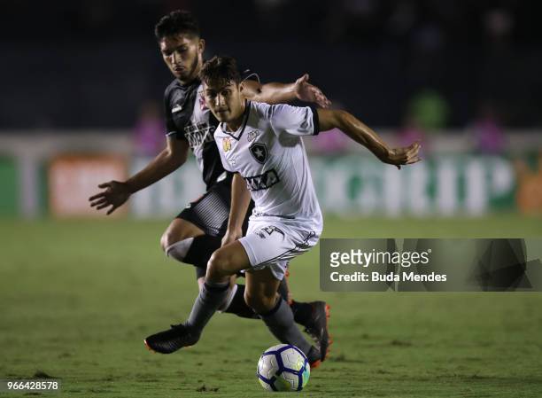 Henrique of Vasco da Gama struggles for the ball with Marcinho of Botafogo during a match between Vasco da Gama and Botafogo as part of Brasileirao...