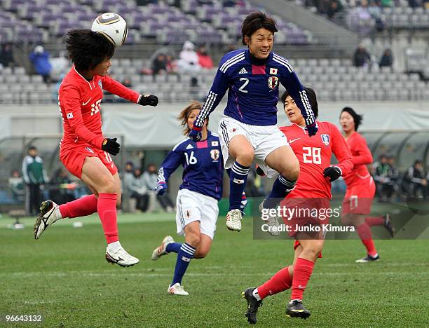 Yukari Kinga of Japan and Jang Mi Lee of South Korea compete for the ball during the East Asian Football Federation Women's Championship 2010 match...