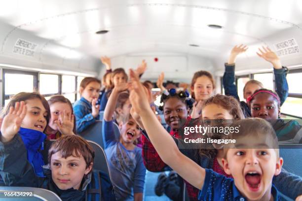 school kids in a bus - out bus window stock pictures, royalty-free photos & images