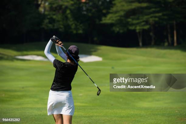 golfer making the chip - golfer stock pictures, royalty-free photos & images