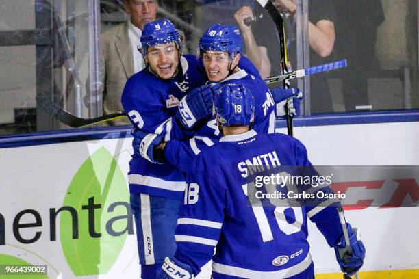 Trevor Moore of the Marlies celebrates his goal with his line mates Dmytro Timashov and Ben Smith during the 3rd period of the Calder Cup Finals game...