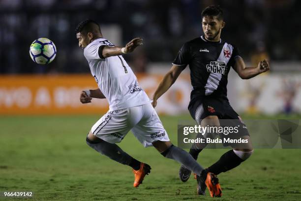 Henrique of Vasco da Gama struggles for the ball with Rodrigo Aguirre of Botafogo during a match between Vasco da Gama and Botafogo as part of...