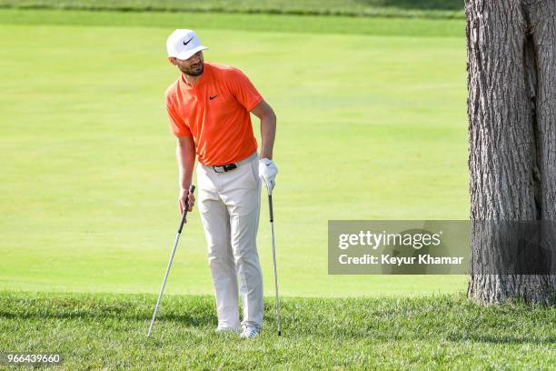 Kyle Stanley decides between clubs on the 18th hole fairway during the third round of the Memorial Tournament presented by Nationwide at Muirfield...