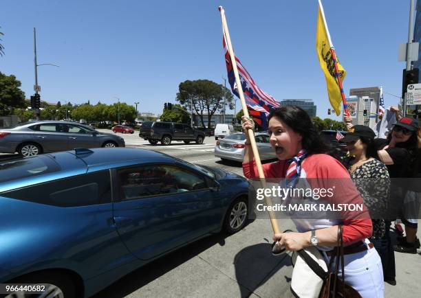 Ingrid Mueller joins supporters of US President Trump as they hold a 'Make California Great Again' rally to support Los Angeles County's Republican...