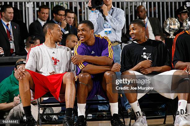 Tre Gilder of the Maine Red Claws, Dar Tucker of the Los Angeles D-Fenders and Alonzo Gee of the Austin Toros talk during the Slam Dunk Contest as...