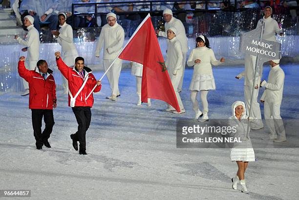 The athletes of Morrocco, led by flagbearer, alpine skiier Samir Azzimani, enter the stadium during the opening ceremonies at the BC Place for the...
