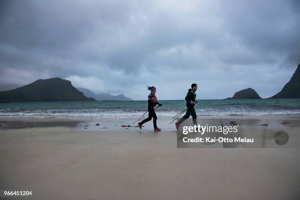 Athletes running over Haukeland beach at The Arctic Triple - Lofoten Ultra-Trail on June 2, 2018 in Svolvar, Norway. Lofoten Ultra-Trail is one of...