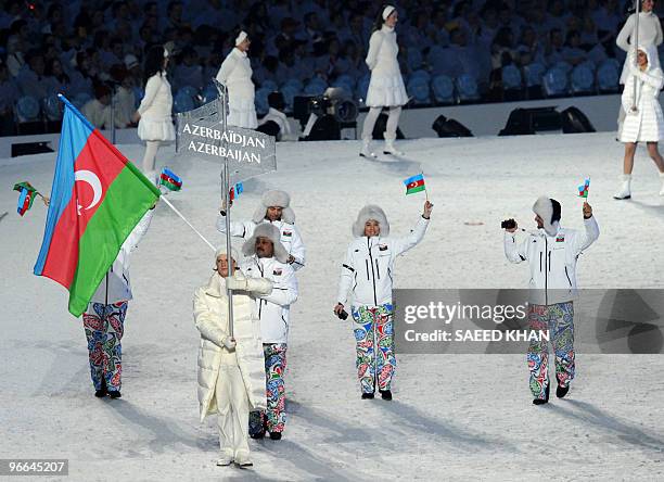 Azerbaijan's flagbearer, alpine skier Fuad Guliyev, heads the delegation during the 2010 Winter Olympics inauguration ceremony at the BC Place in...