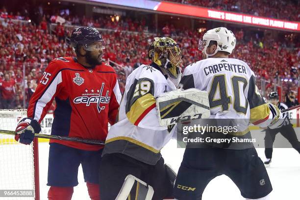 Ryan Carpenter of the Vegas Golden Knights is separated by Marc-Andre Fleury after exchanging words with Devante Smith-Pelly of the Washington...