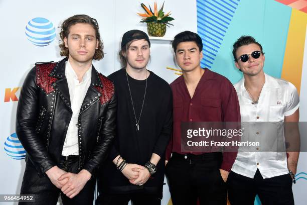 Luke Hemmings, Michael Clifford, Calum Hood, and Ashton Irwin of music group 5 Seconds of Summer attend iHeartRadio's KIIS FM Wango Tango by AT&T at...