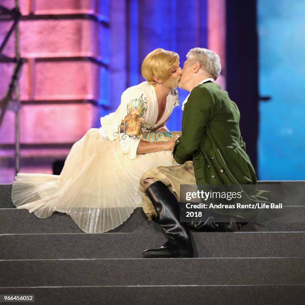 Conchita Wurst and Herbert Foettinger perform on stage during the Life Ball 2018 show at City Hall on June 2, 2018 in Vienna, Austria. The Life Ball,...