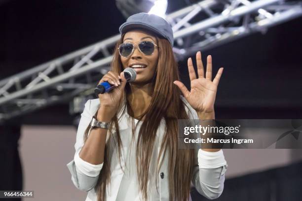 Model Cynthia Bailey speaks on stage during the Atlanta Ultimate Women's Expo at Georgia World Congress Center on June 2, 2018 in Atlanta, Georgia.