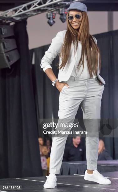 Model Cynthia Bailey walks the runway during the Atlanta Ultimate Women's Expo at Georgia World Congress Center on June 2, 2018 in Atlanta, Georgia.