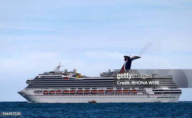 The Carnival Cruise Ship 'Carnival Glory' heads out to sea in the Miami harbor entrance known as Government Cut in Miami, Florida June 2, 2018.