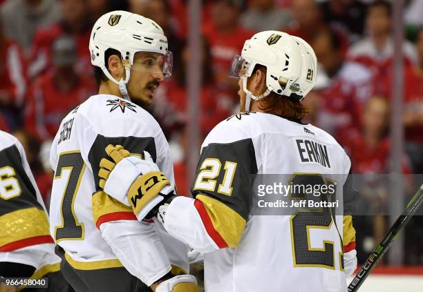 Cody Eakin and Luca Sbisa of the Vegas Golden Knights confer during a break in action during the second period against the Washington Capitals in...