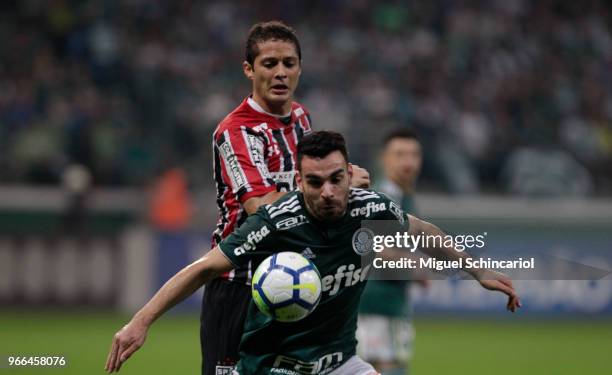 Bruno Henrique of Palmeiras vies the ball with Anderson Martins of Sao Paulo during a match between Palmeiras and Sao Paulo for the Brasileirao...