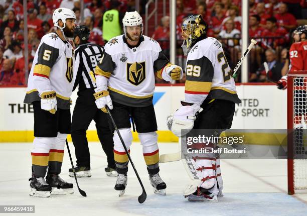 Brayden McNabb congratulates Marc-Andre Fleury of the Vegas Golden Knights after making a save during the second period against the Washington...