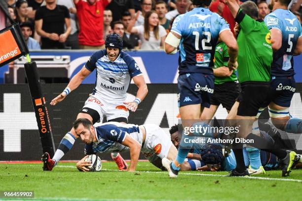 Julien Dumora of Castres scores a try during the French Final Top 14 match between Montpellier and Castres at Stade de France on June 2, 2018 in...