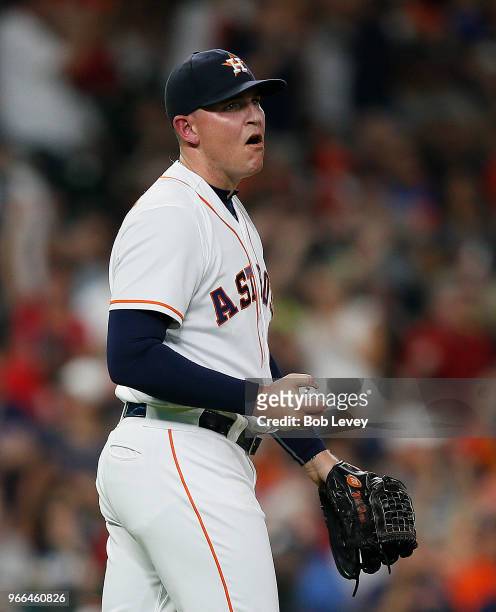 Will Harris of the Houston Astros reacts after giving up a two-run home run to Andrew Benintendi of the Boston Red Sox in the seventh inning at...
