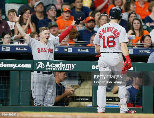 Brock Holt of the Boston Red Sox celebrates the tqo-run home run of Andrew Benintendi in hte seventh inning against the Houston Astros at Minute Maid...