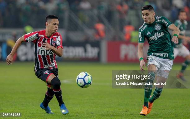 Marcos Guilherme of Sao Paulo vies the ball with Diogo Barbosa of Palmeiras during a match between Palmeiras and Sao Paulo for the Brasileirao Series...