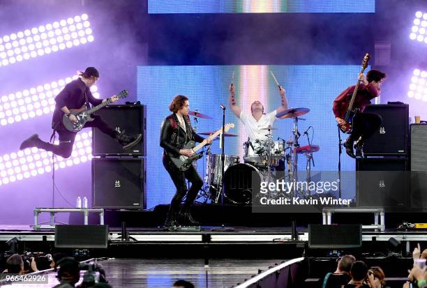 Michael Clifford, Luke Hemmings, Ashton Irwin , and Calum Hood of music group 5 Seconds of Summer perform onstage during the 2018 iHeartRadio Wango...