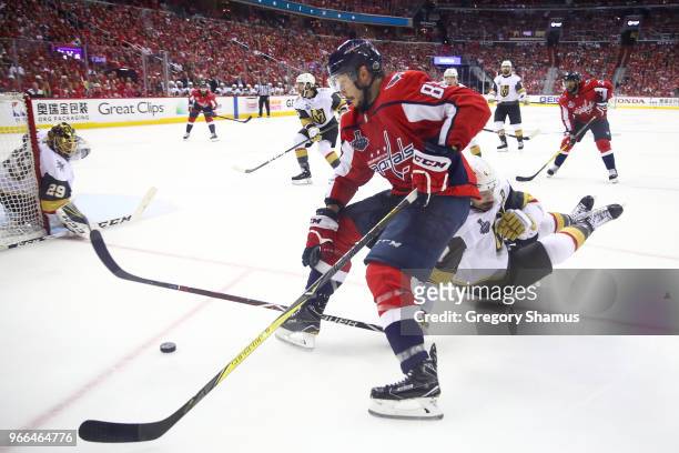 Jay Beagle of the Washington Capitals battles for the puck with Luca Sbisa of the Vegas Golden Knights during the third period in Game Three of the...