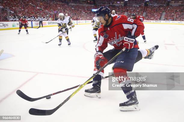 Jay Beagle of the Washington Capitals battles for the puck with Luca Sbisa of the Vegas Golden Knights during the third period in Game Three of the...